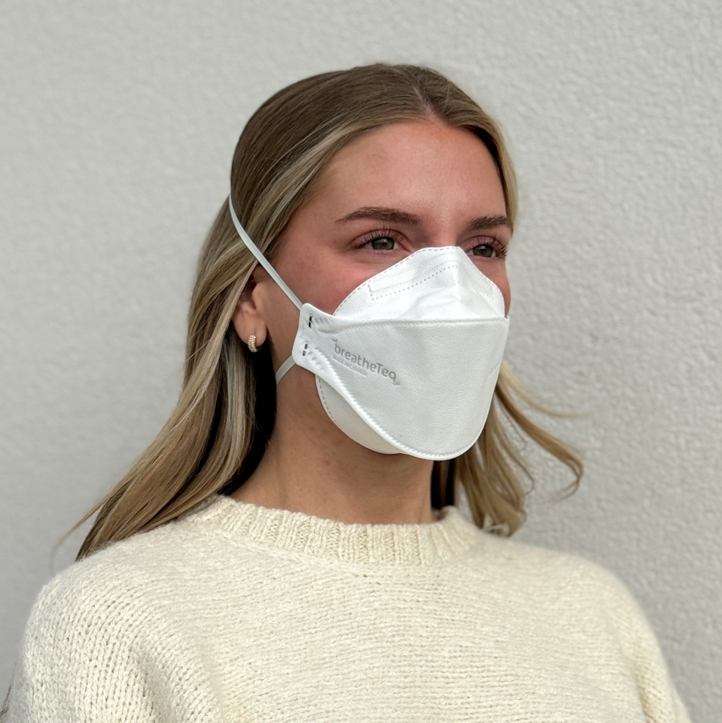 woman wearing white KN95 respirator mask with headbands breathable made by Breatheteq USA and Canada Masq - sold by Canada Strong Masks